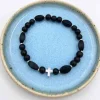 By Gabay, Armbånd med sølvkors, glas- og træperler